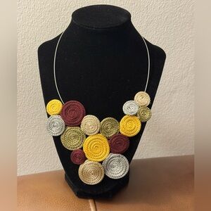 Crochet necklace cluster of colorful circular pendants on choker necklace